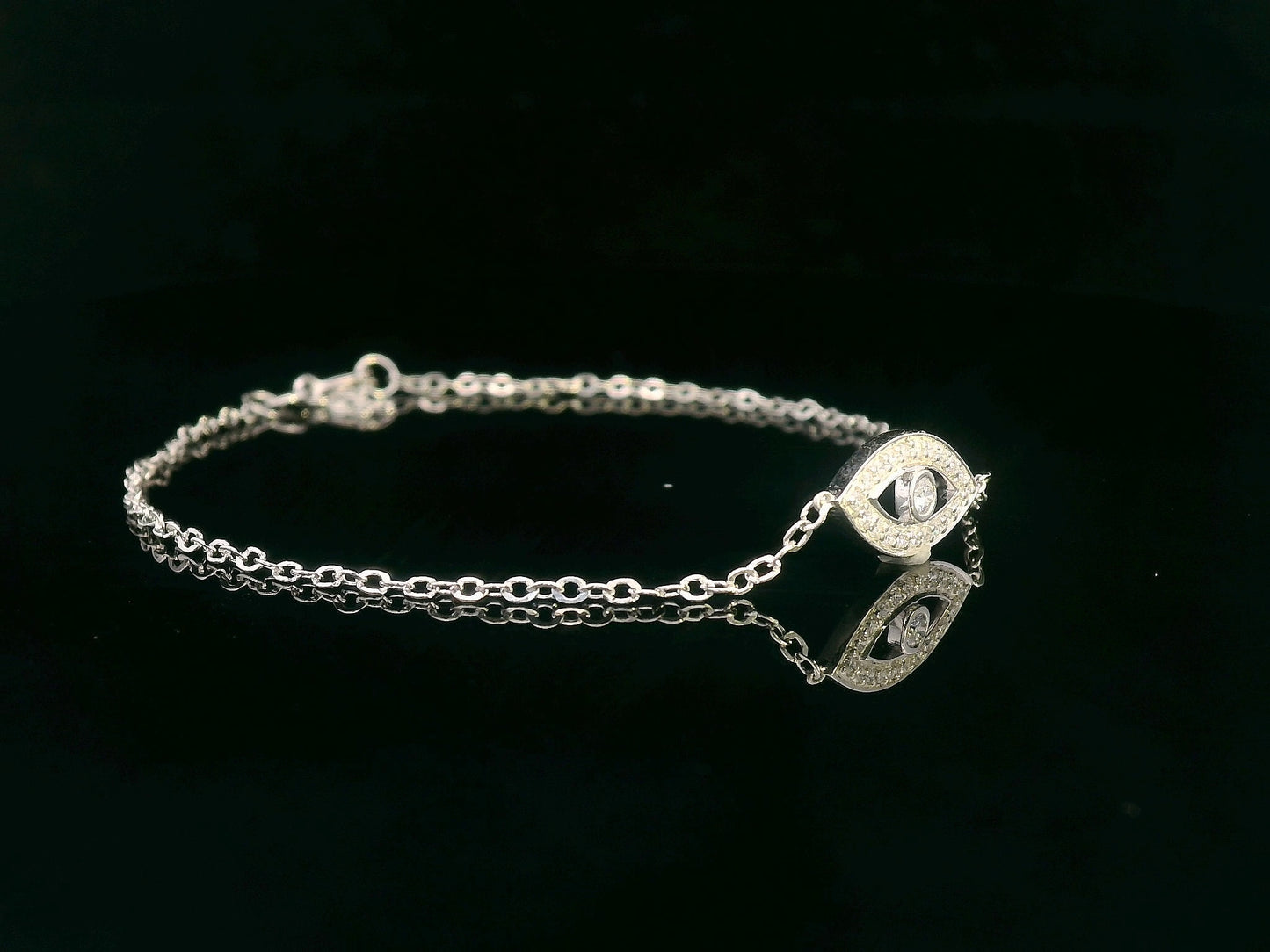18K white gold evil eye bracelet with 0.14 carat diamonds on a delicate chain