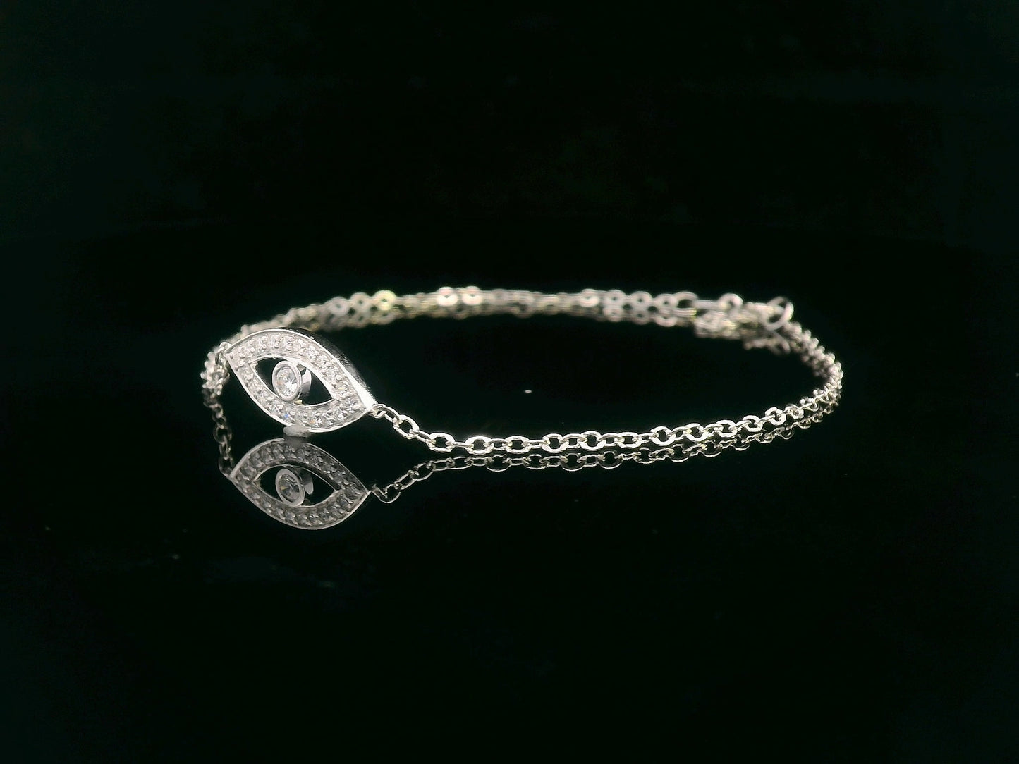 18K white gold evil eye bracelet with 0.14 carat diamonds on a delicate chain