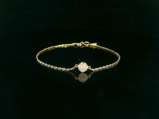 18K yellow gold chain bracelet with a 0.15 carat round diamond cluster centerpiece