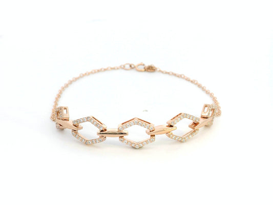 18K gold bracelet with five diamond-encrusted hexagon links and chain-link design