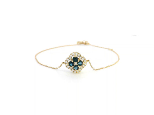 18K gold bracelet with floral blue sapphires and white diamond halo
