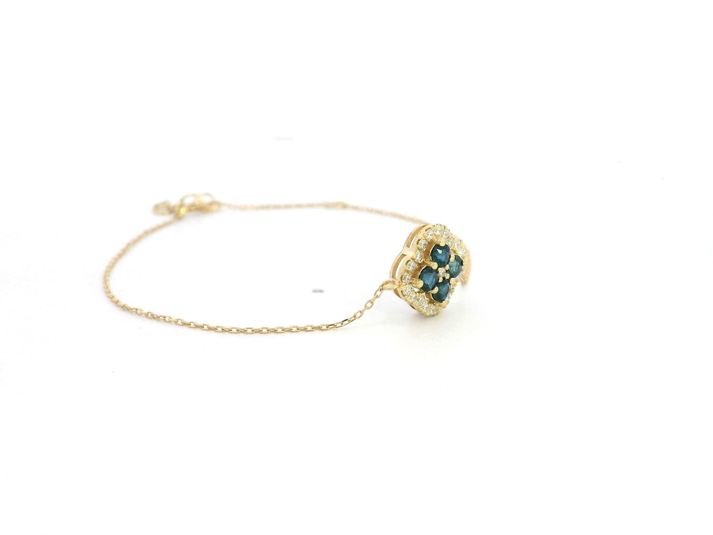 18K gold bracelet with floral blue sapphires and white diamond halo