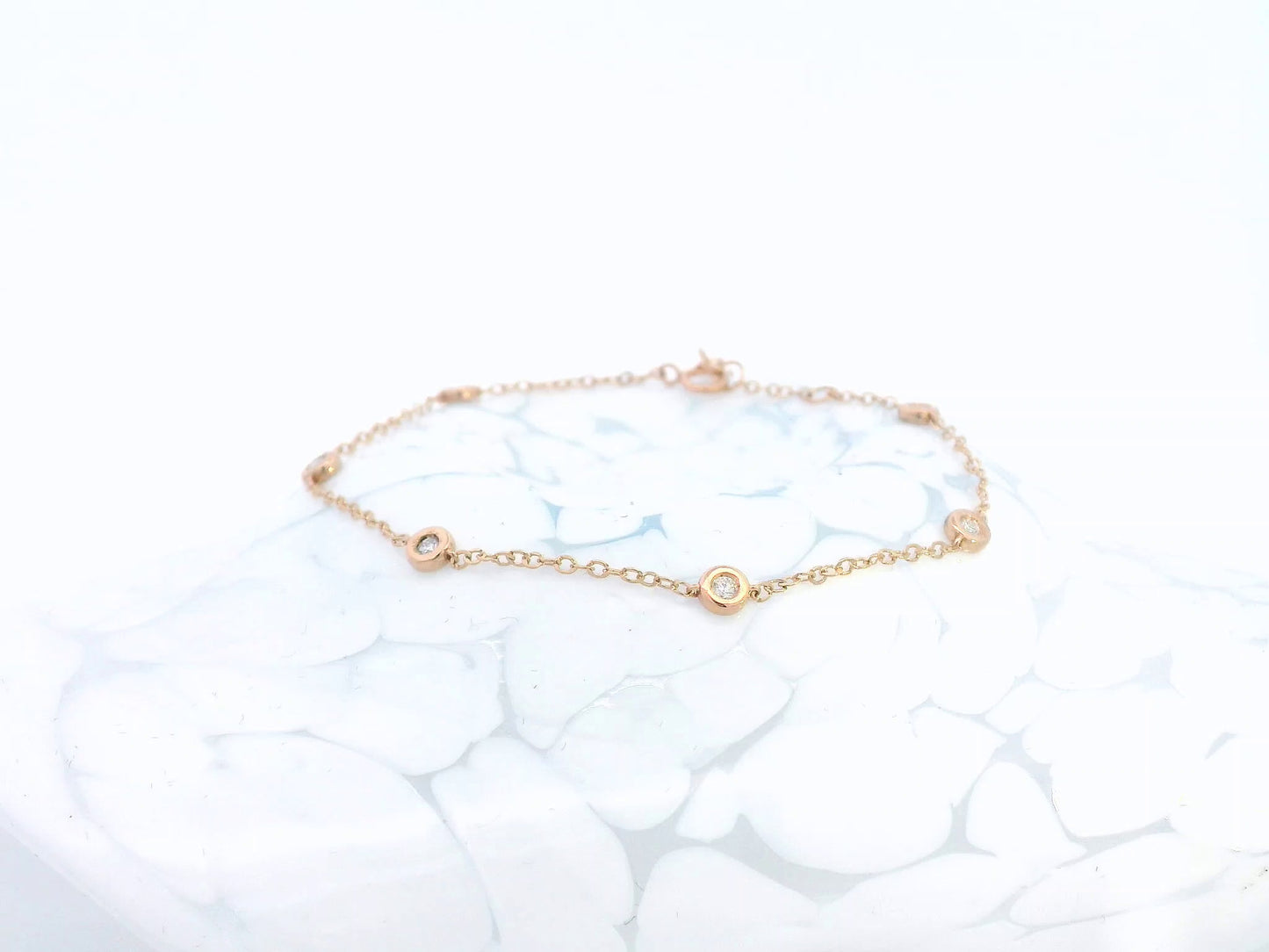 18K rose gold bracelet with round bezel-set diamonds – 0.18 carats total