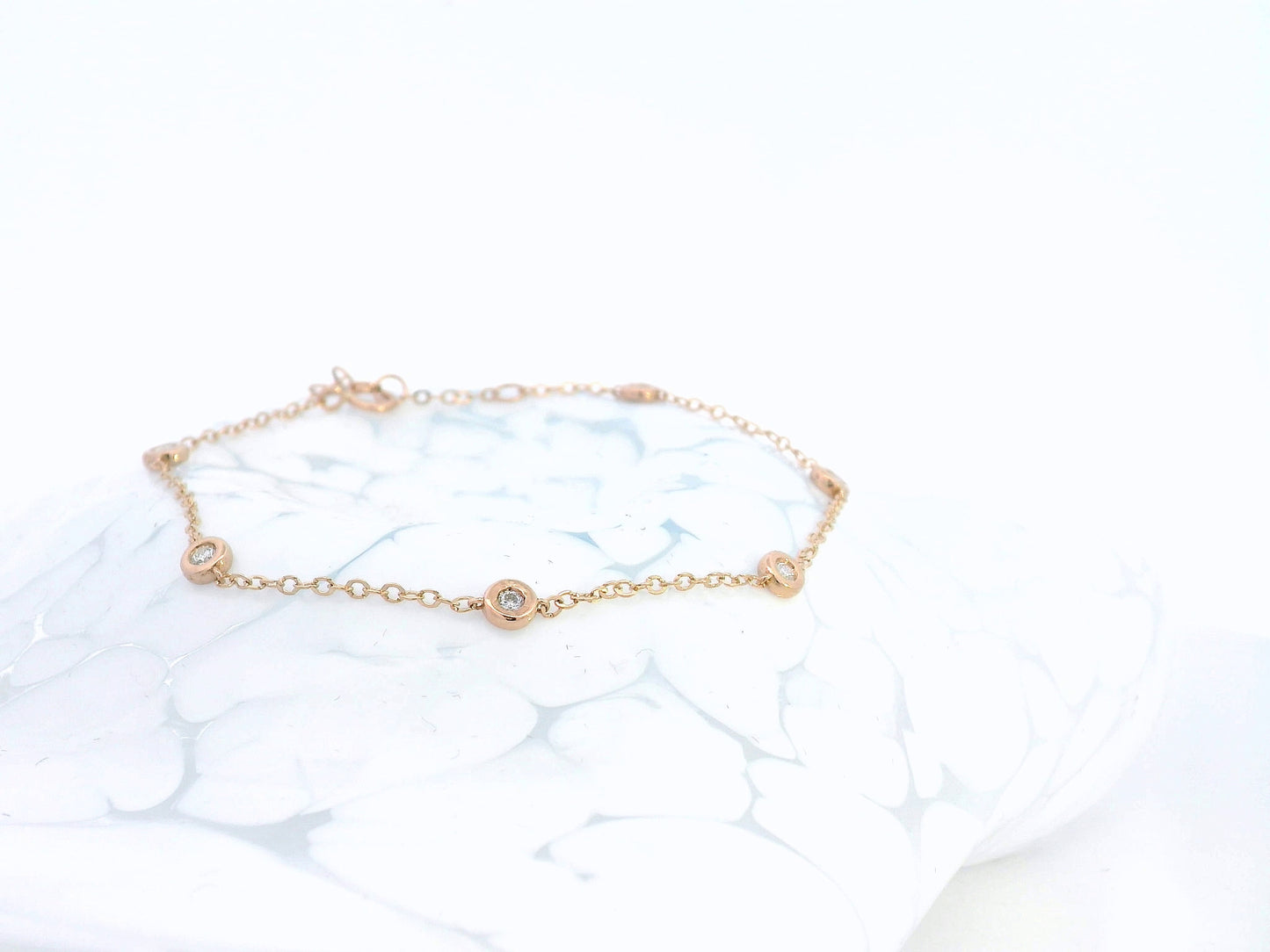 18K rose gold bracelet with round bezel-set diamonds – 0.18 carats total
