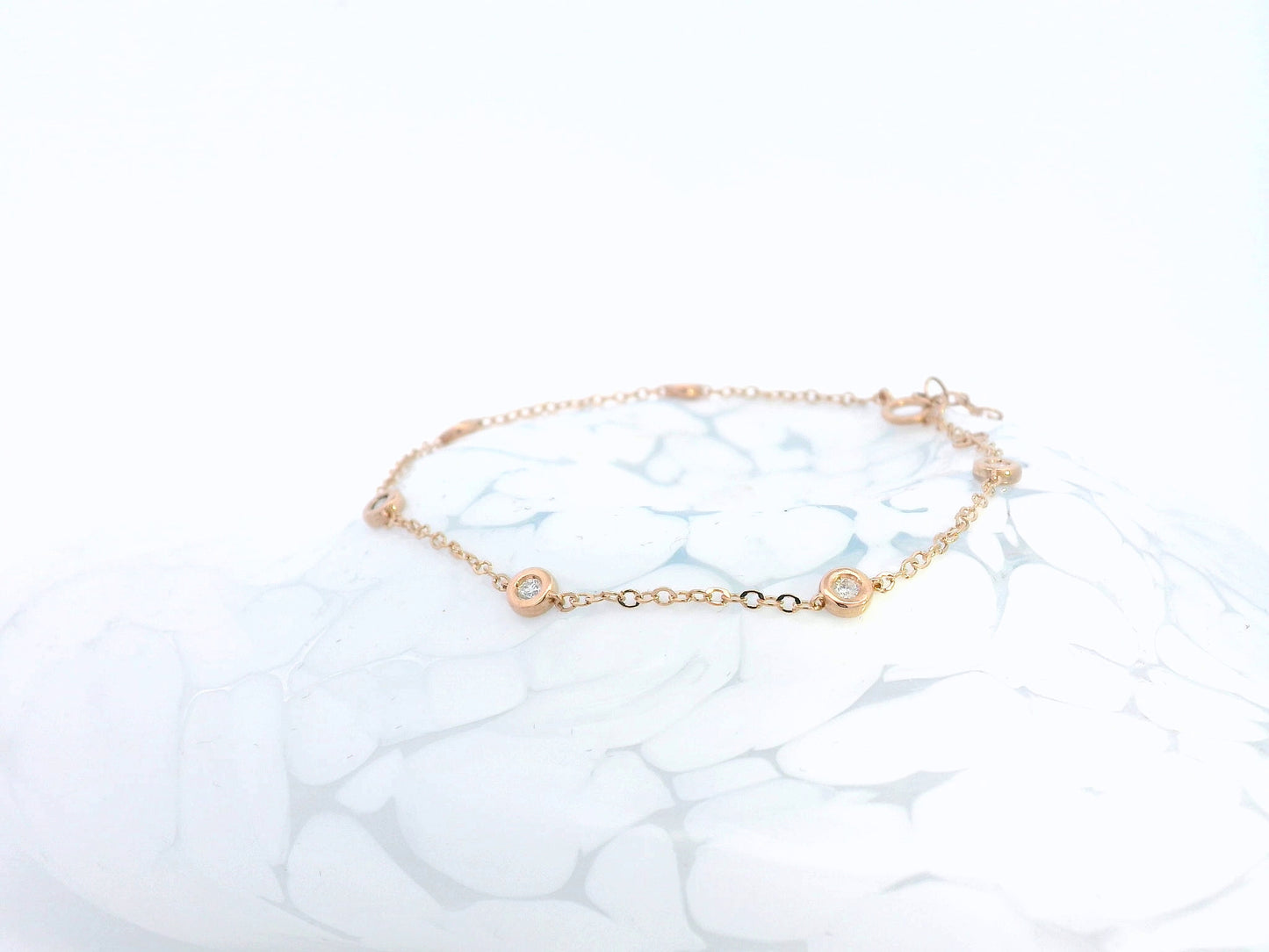 18K rose gold bracelet with round bezel-set diamonds – 0.18 carats total