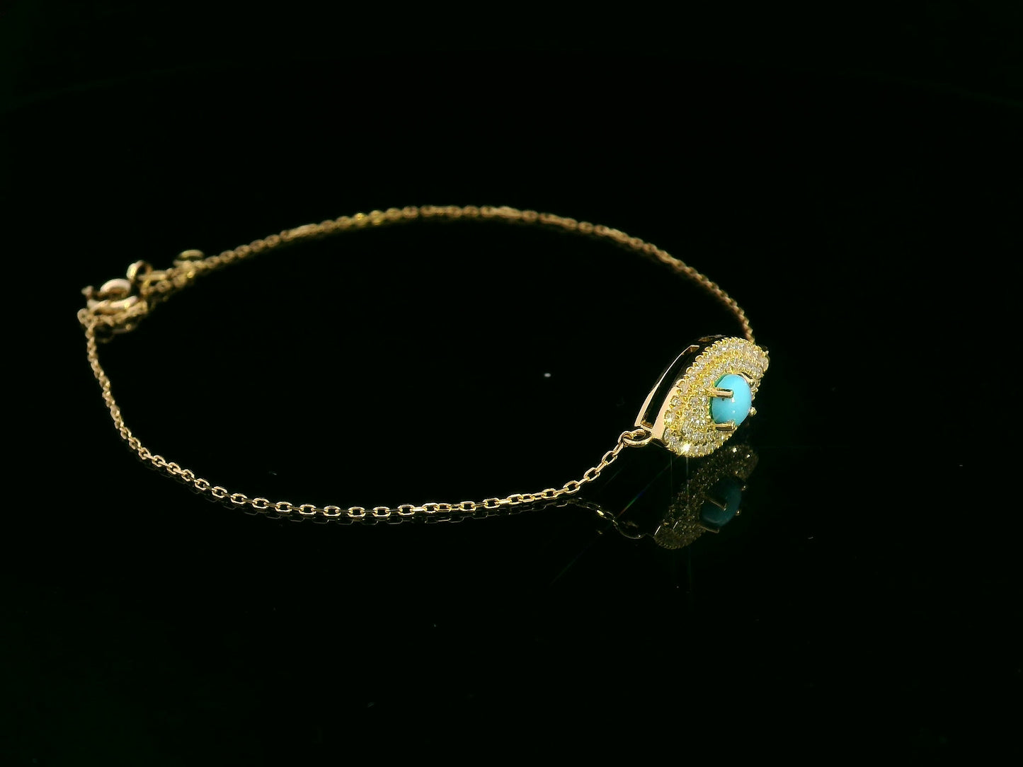 18K yellow gold turquoise and diamond evil eye bracelet – pavé diamond halo with turquoise center by Emirates Diamonds.