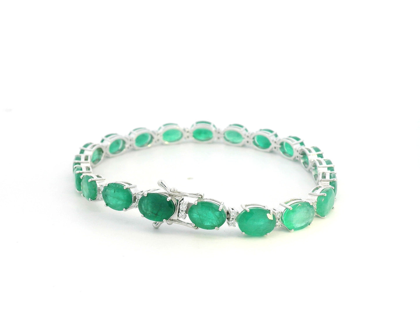 18K white gold emerald and diamond tennis bracelet with oval-cut emeralds, 23.29 carat emeralds by Emirates Diamonds
