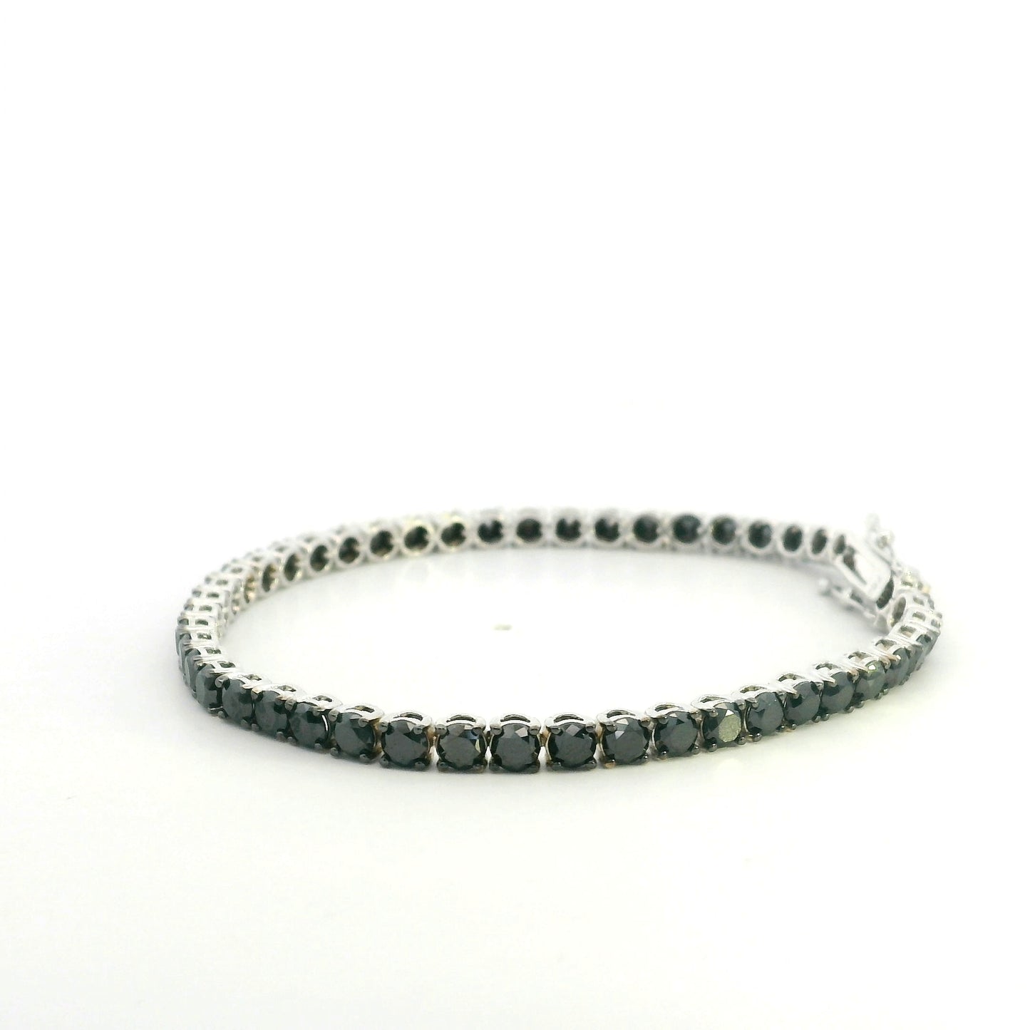18K white gold black diamond tennis bracelet featuring a continuous row of round natural black diamonds totaling 8.38 carats