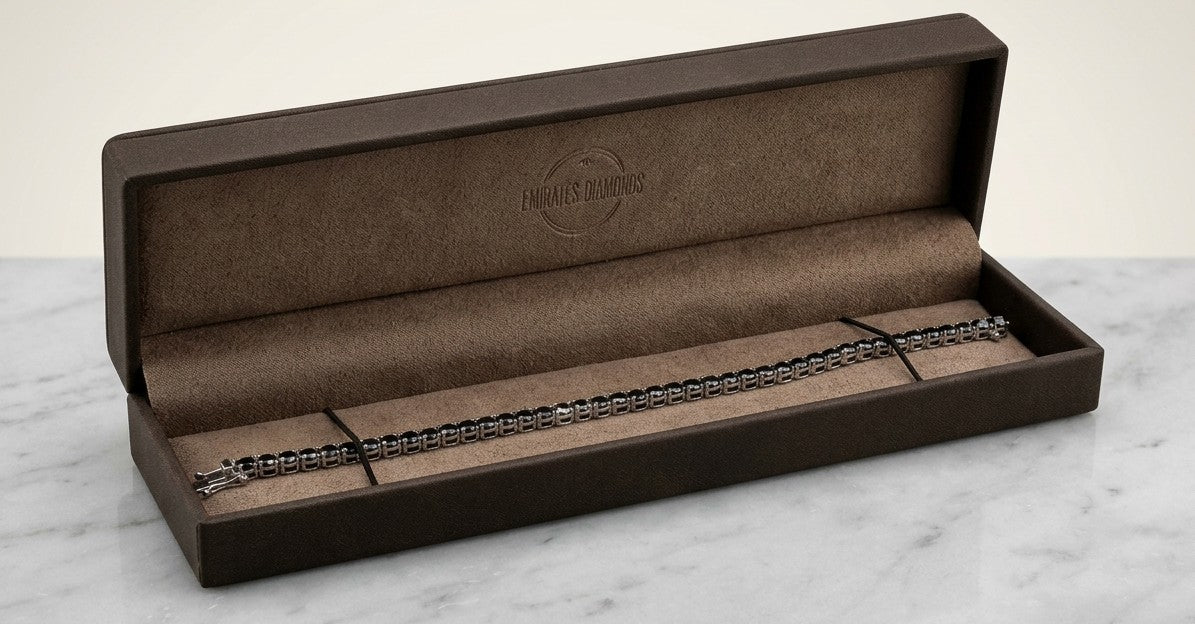 Black diamond tennis bracelet in 18K white gold with a continuous single row of round black diamonds