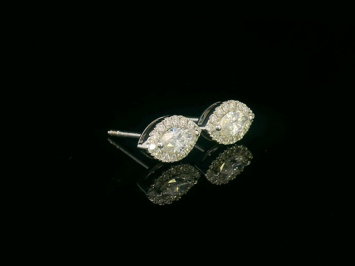18K gold marquise diamond halo stud earrings with round-cut diamond accents – 0.69 carat total weight