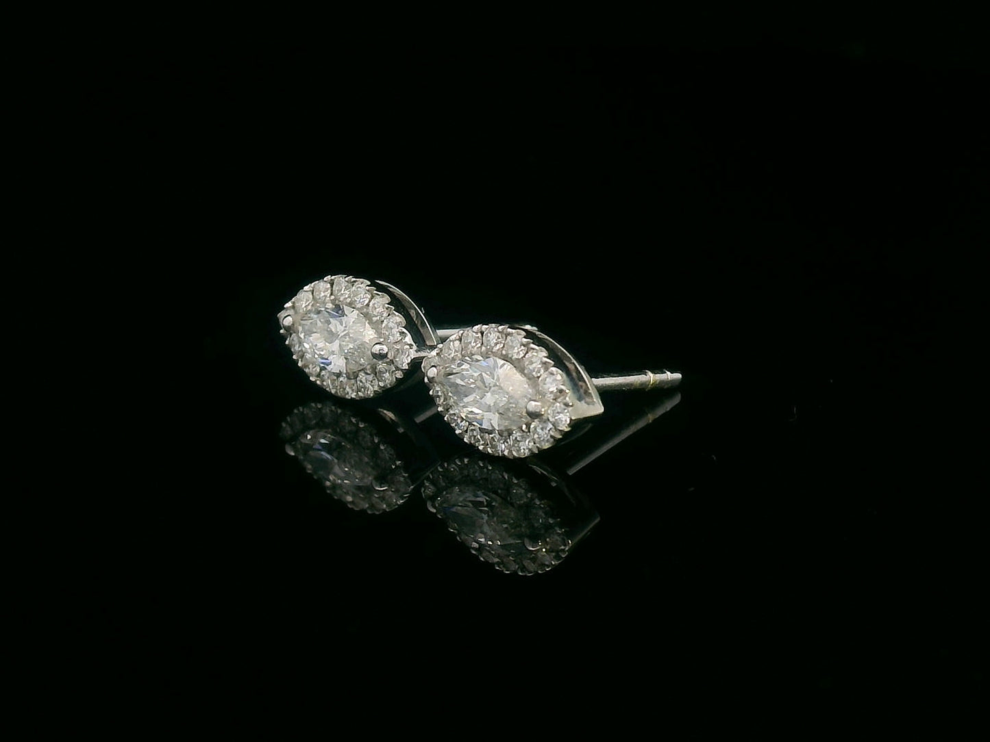 18K gold marquise diamond halo stud earrings with round-cut diamond accents – 0.69 carat total weight
