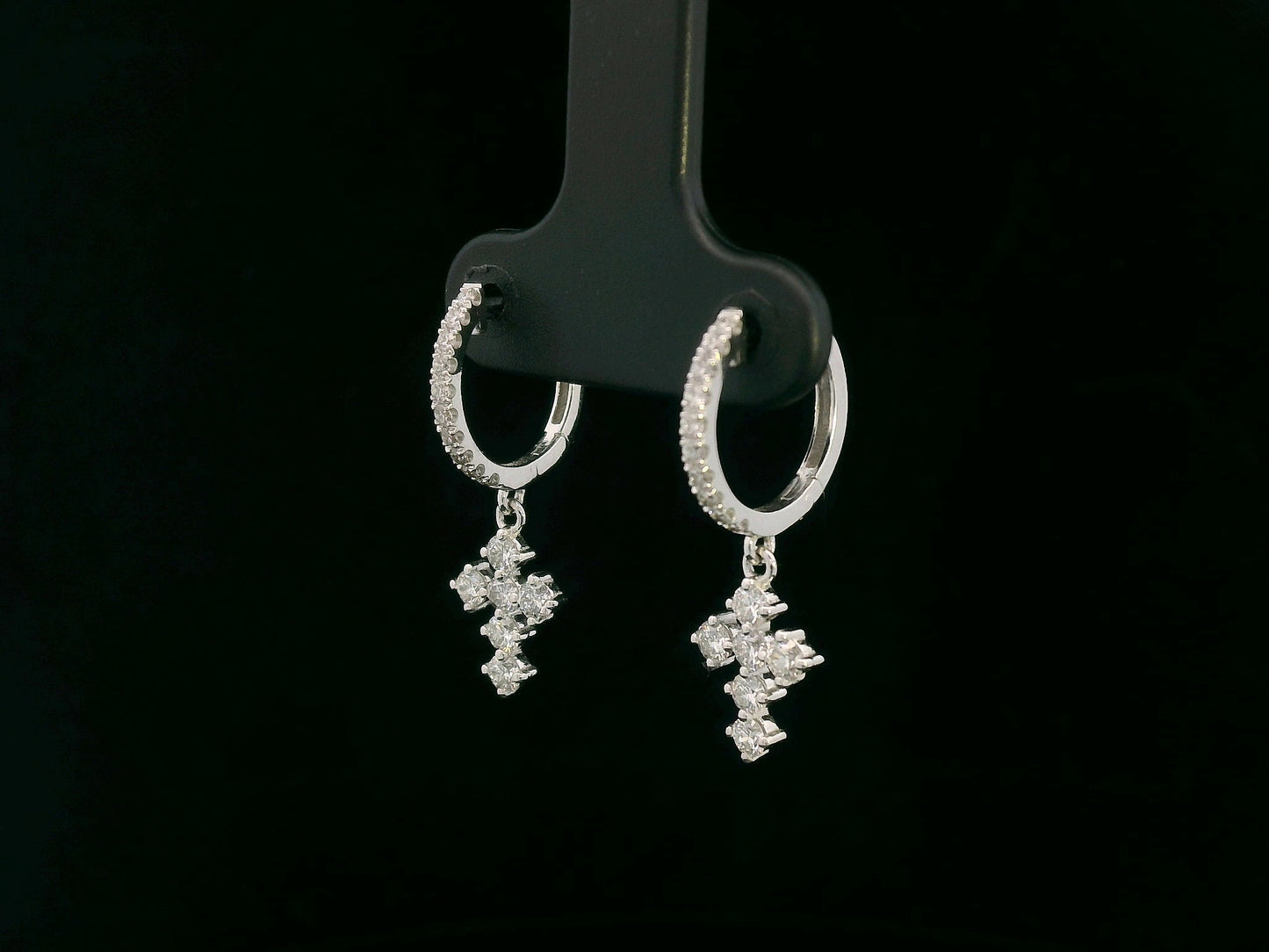 Diamond cross hoop earrings in 18K white gold with 0.73 carat natural diamonds.