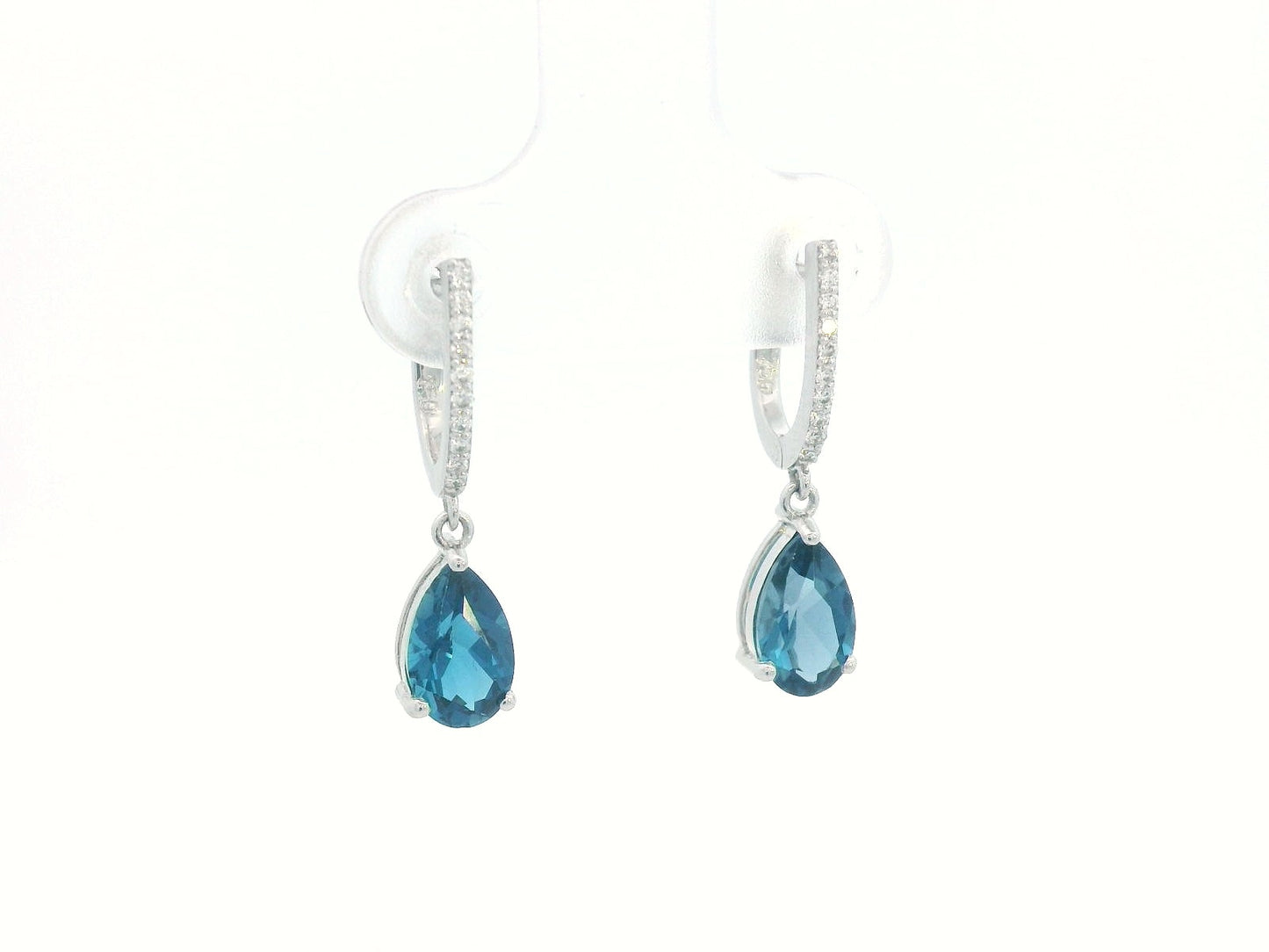 18K gold drop earrings featuring pear-cut London Blue Topaz (1.94 carats) with round-cut diamonds (0.08 carats), set in elegant diamond-studded huggie hoops.