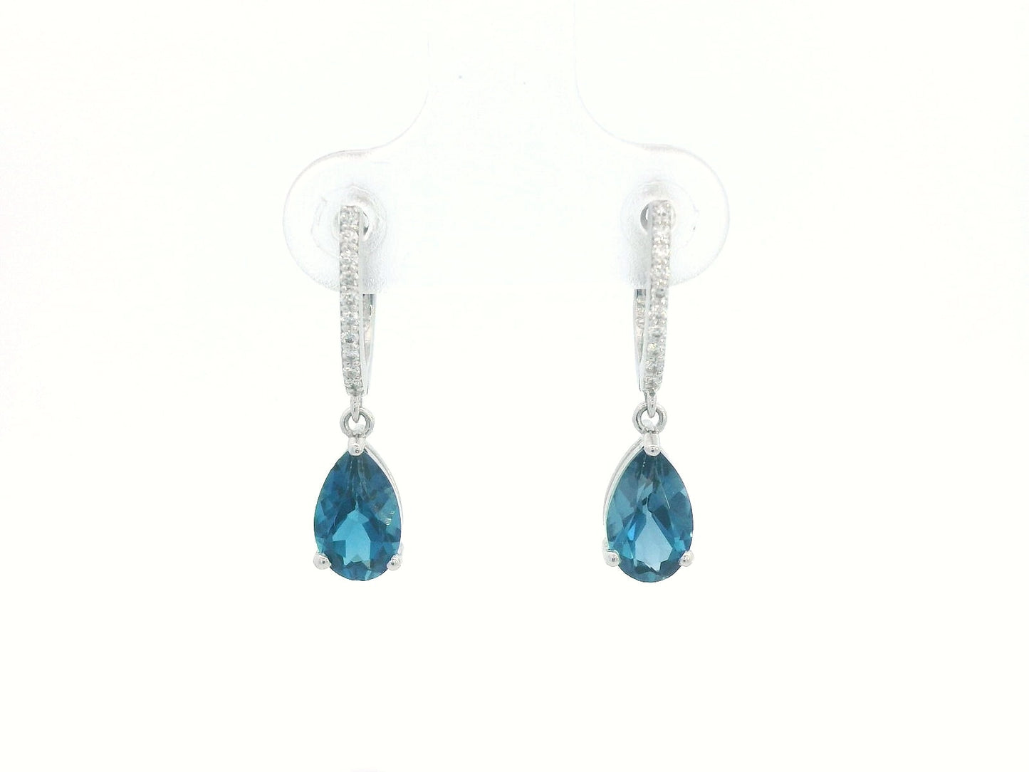 18K gold drop earrings featuring pear-cut London Blue Topaz (1.94 carats) with round-cut diamonds (0.08 carats), set in elegant diamond-studded huggie hoops.