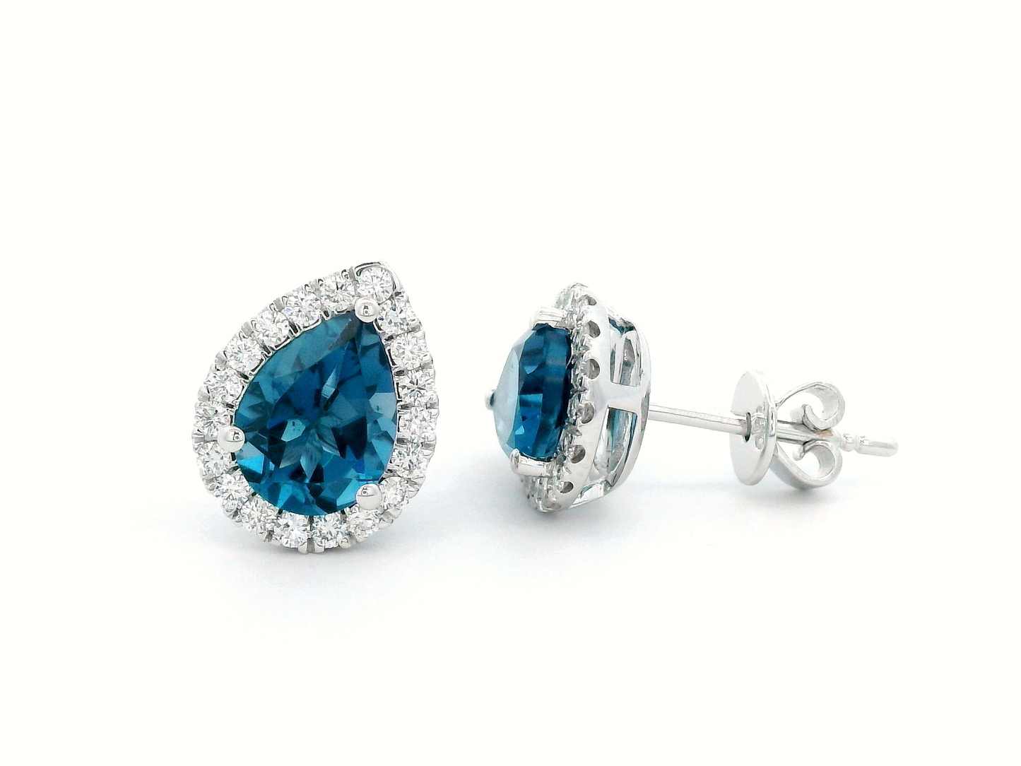 18k gold earrings featuring a pair of 2.53-carat total London Blue Topaz stones, surrounded by a total of 0.39-carat diamonds in a halo design.