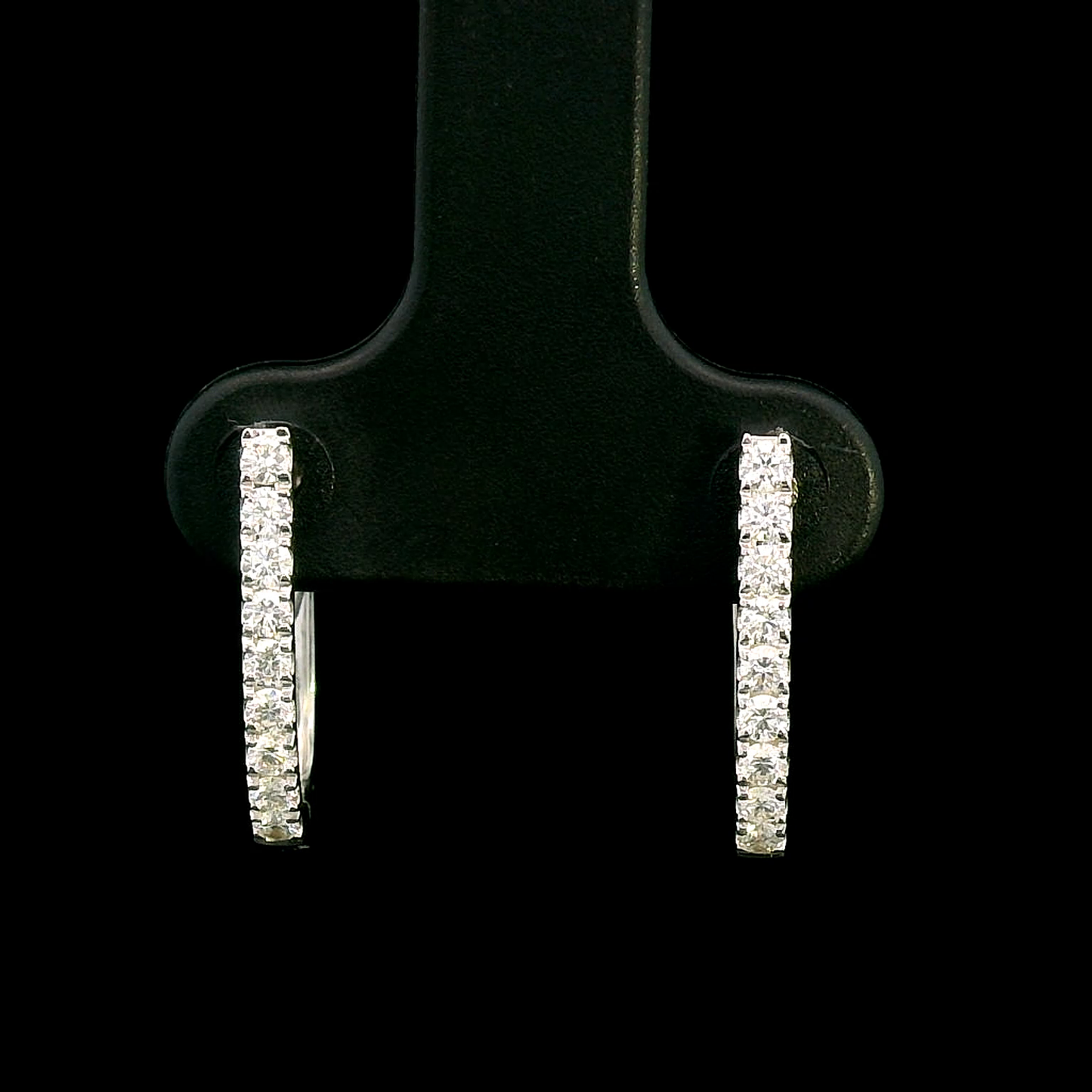 18K gold diamond huggie hoop earrings featuring 0.31 carats of round-cut diamonds in a sleek, elegant design – perfect for any occasion.