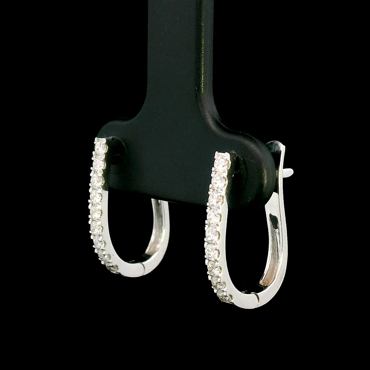 18K gold diamond huggie hoop earrings featuring 0.31 carats of round-cut diamonds in a sleek, elegant design – perfect for any occasion.