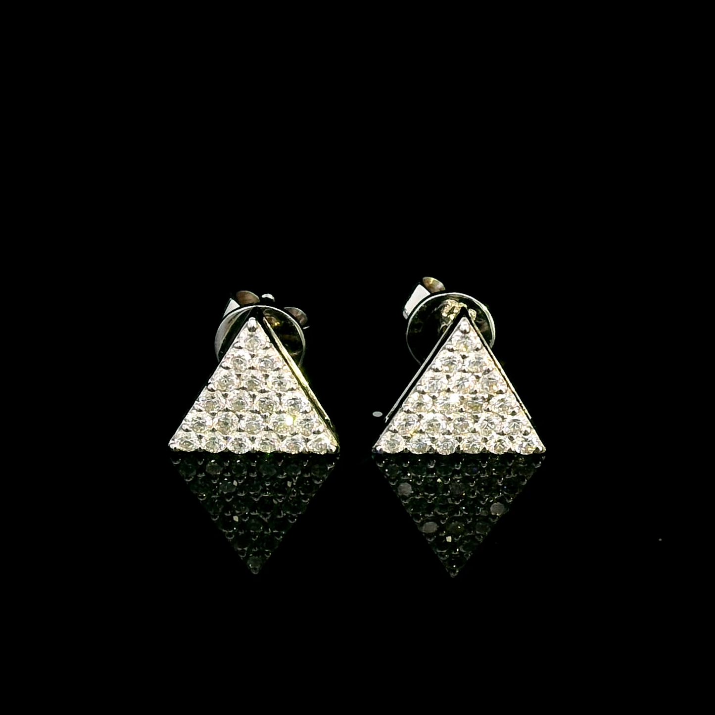 A pair of minimalist 18K white gold triangle diamond earrings featuring a geometric triangular design with 0.30 carats of round-cut diamonds and push-back closures.