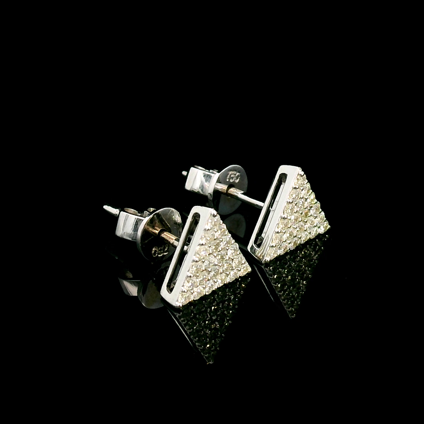 A pair of minimalist 18K white gold triangle diamond earrings featuring a geometric triangular design with 0.30 carats of round-cut diamonds and push-back closures.