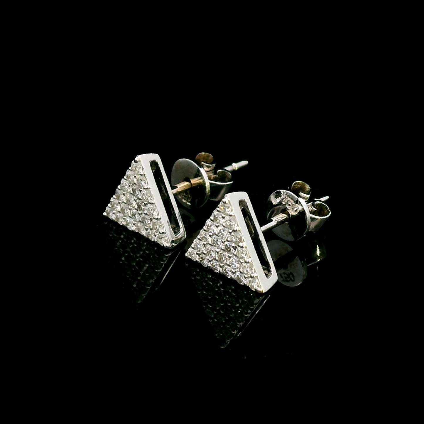 A pair of minimalist 18K white gold triangle diamond earrings featuring a geometric triangular design with 0.30 carats of round-cut diamonds and push-back closures.