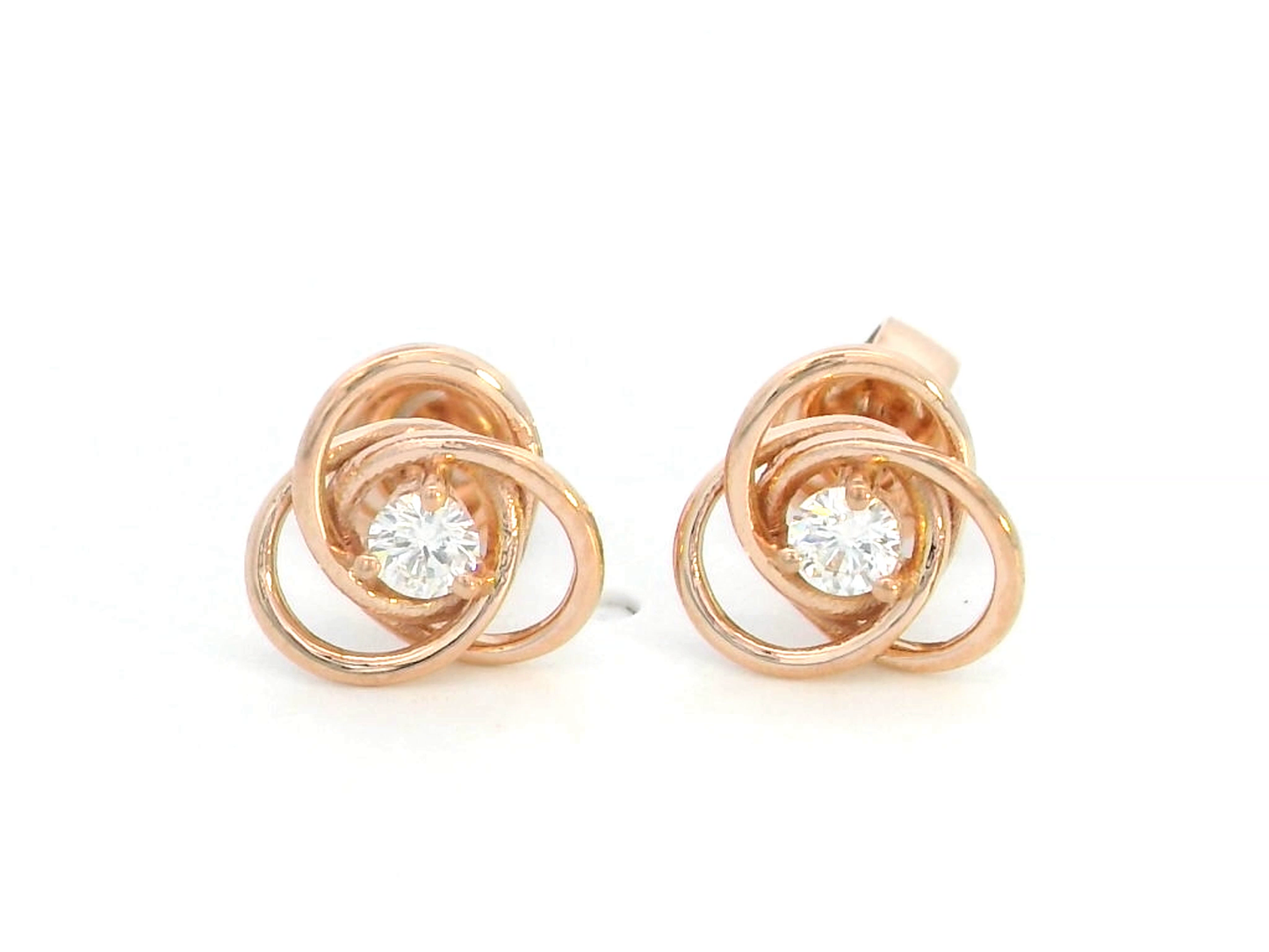18K rose gold knot earrings with a solitaire 0.11-carat diamond at the center, symbolizing elegance and unity.