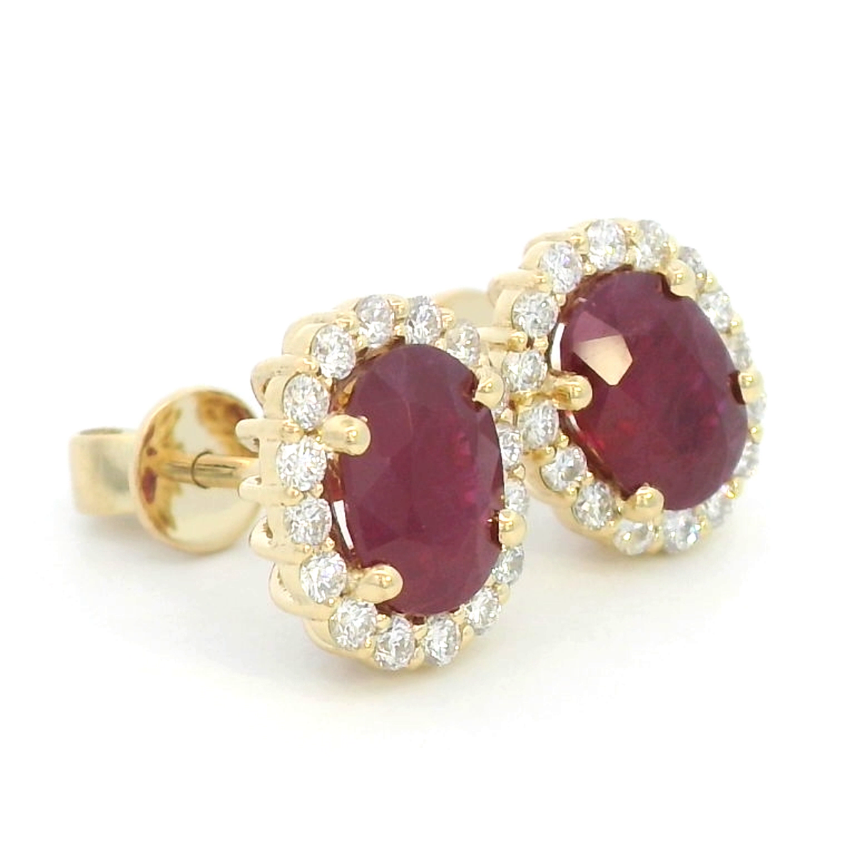 Oval Ruby With Diamond Halo Earrings In 18k Yellow Gold.