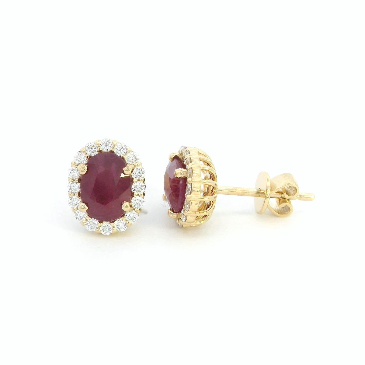 Oval Ruby With Diamond Halo Earrings In 18k Yellow Gold.