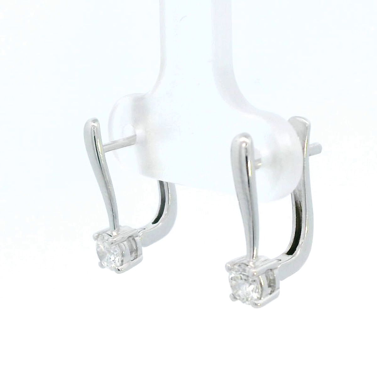 18K gold diamond huggie hoop earrings with 0.45-carat natural diamonds, featuring a secure and elegant design.