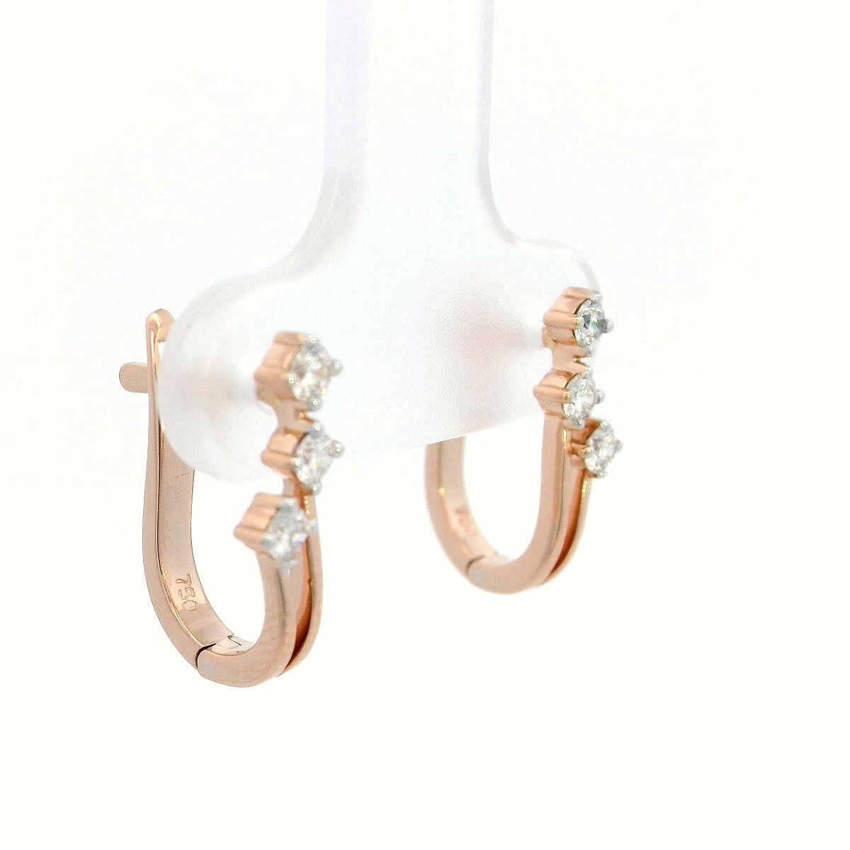 18K gold huggie hoop earrings with 0.24 carats of diamonds in a sleek multi-diamond design.