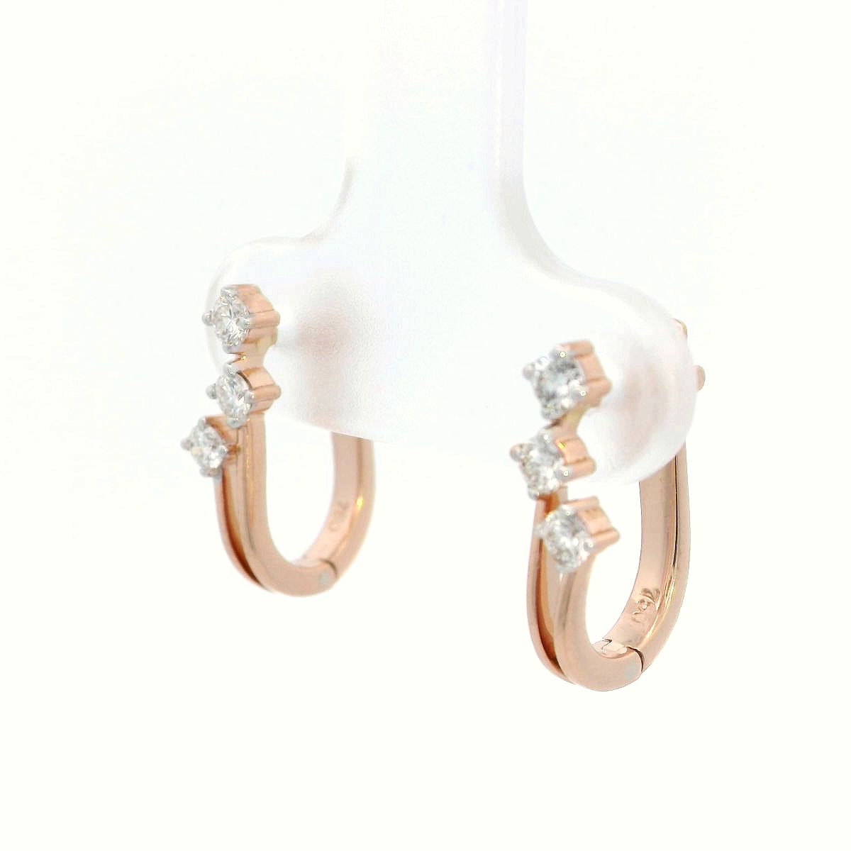18K gold huggie hoop earrings with 0.24 carats of diamonds in a sleek multi-diamond design.