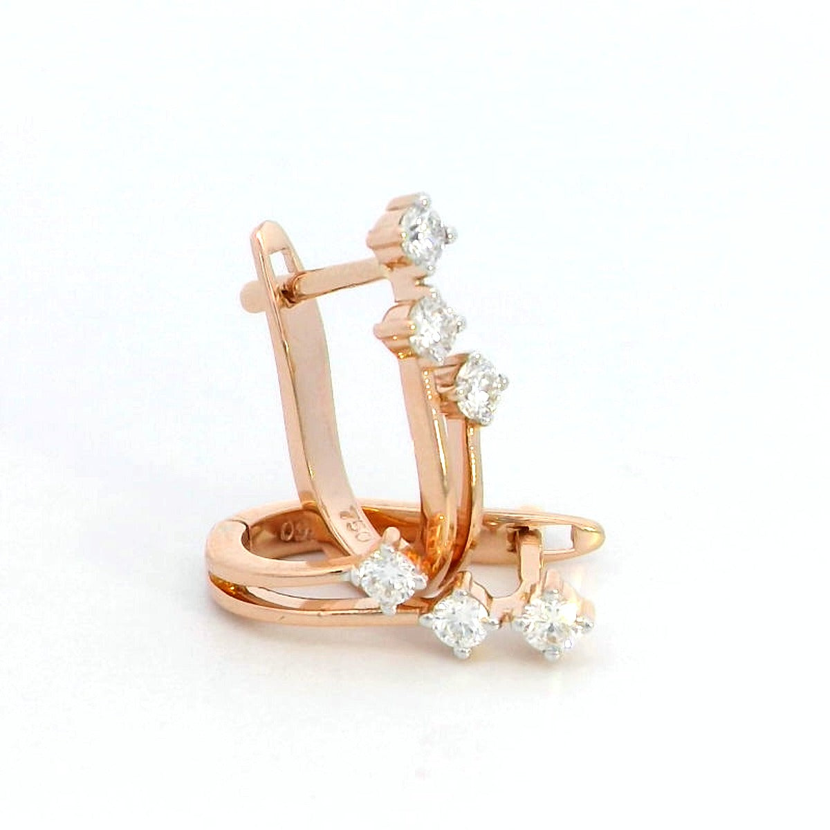 18K gold huggie hoop earrings with 0.24 carats of diamonds in a sleek multi-diamond design.