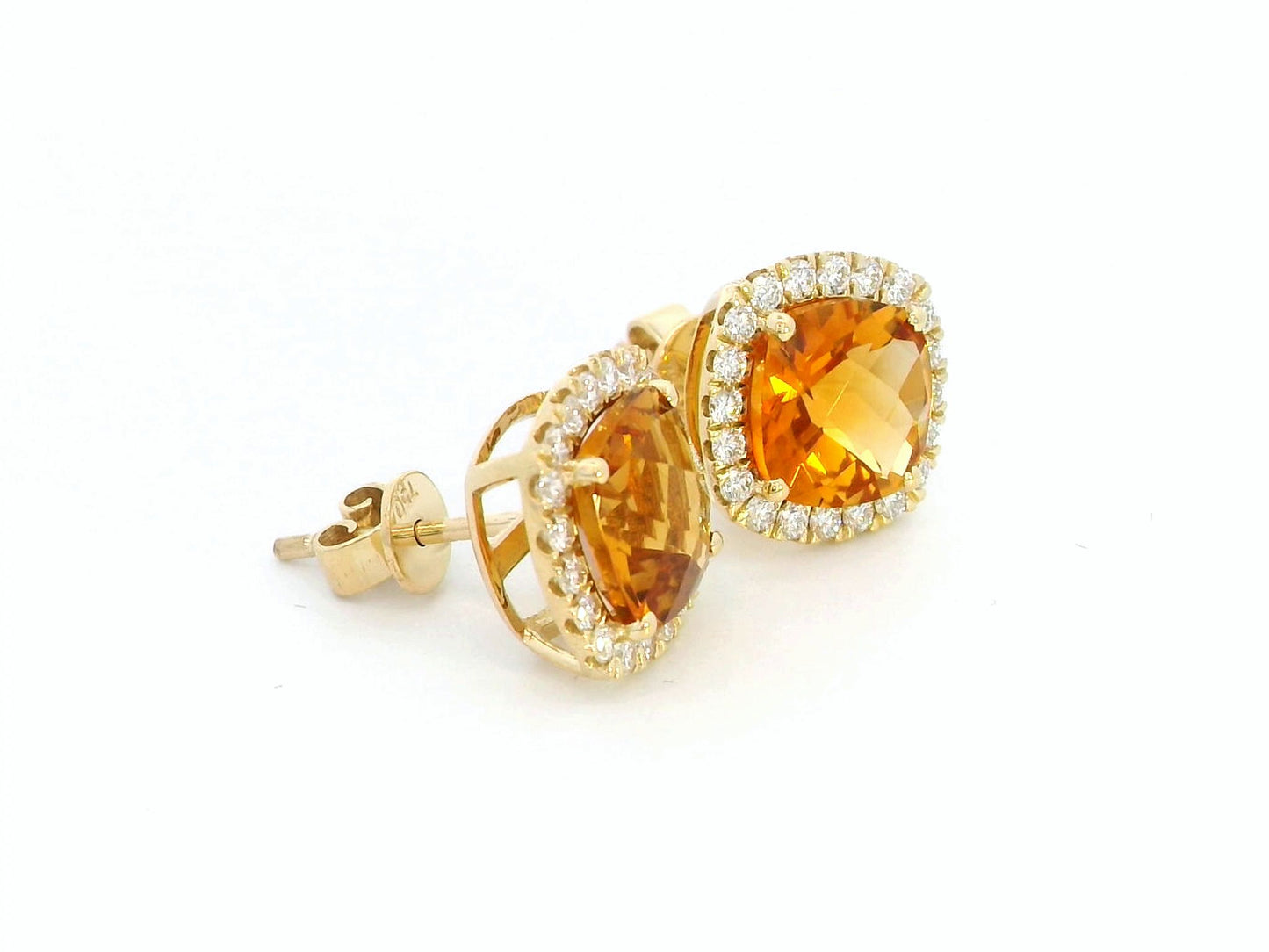 18K yellow gold cushion-cut citrine and diamond halo earrings with 3.91 carats of citrine and 0.57 carats of diamonds.