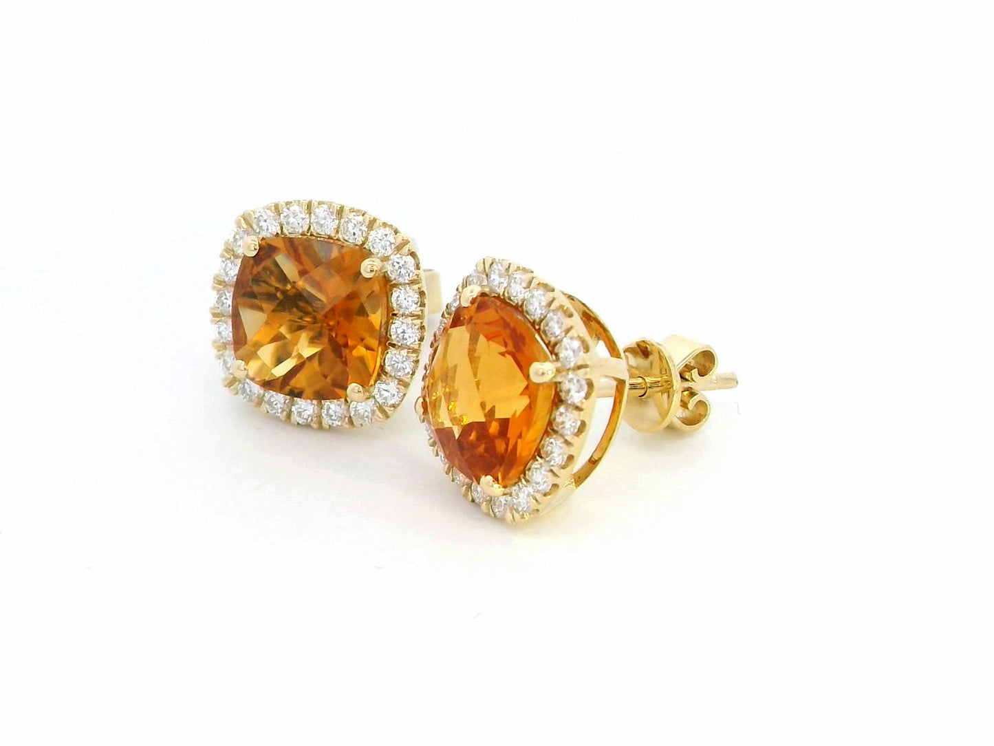 18K yellow gold cushion-cut citrine and diamond halo earrings with 3.91 carats of citrine and 0.57 carats of diamonds.