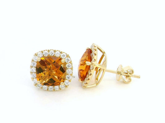 18K yellow gold cushion-cut citrine and diamond halo earrings with 3.91 carats of citrine and 0.57 carats of diamonds.