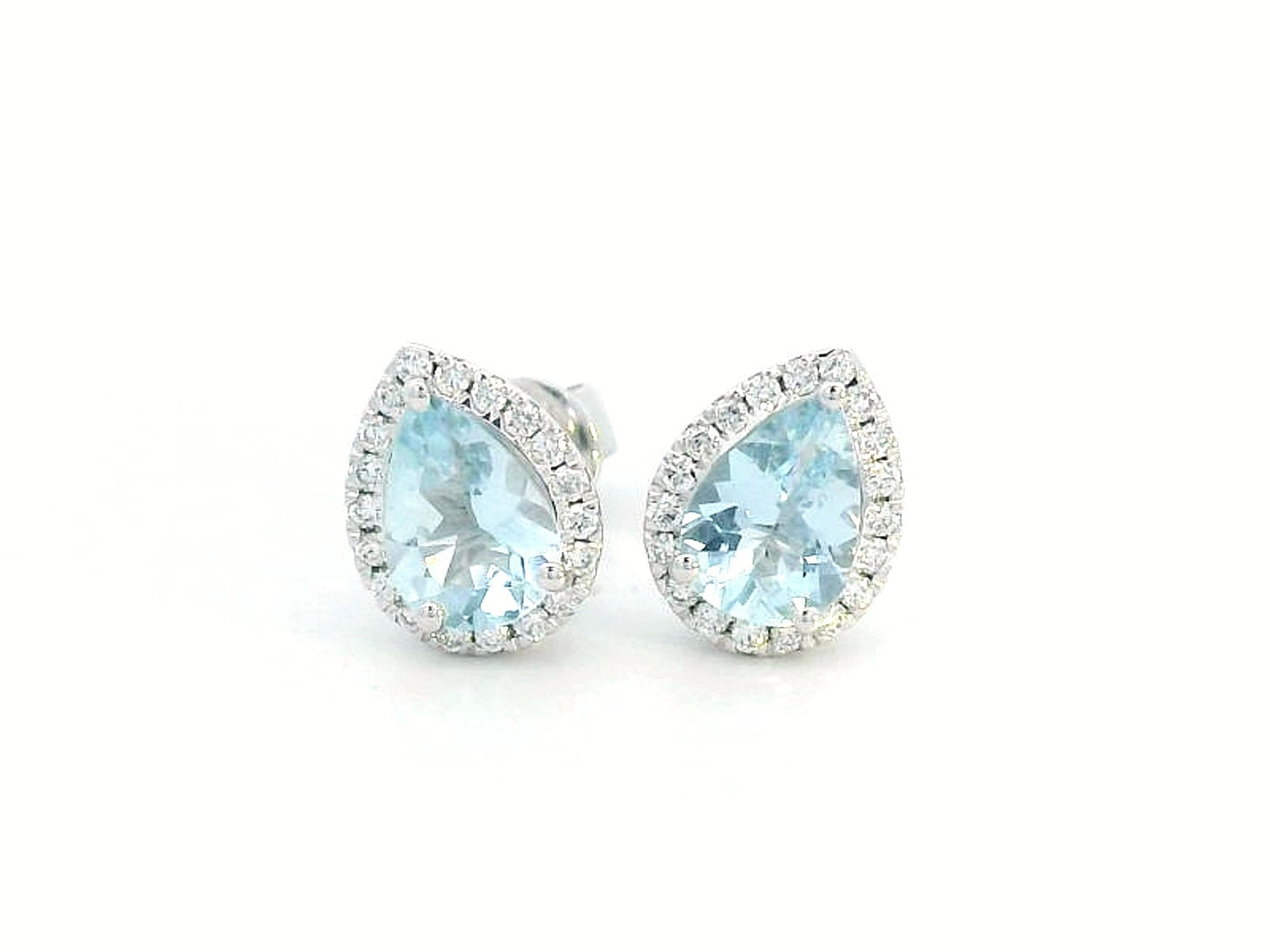 18K gold pear-shaped aquamarine and diamond halo stud earrings featuring 1.21 carats of aquamarine and 0.18 carats of diamonds, set in a timeless halo design.