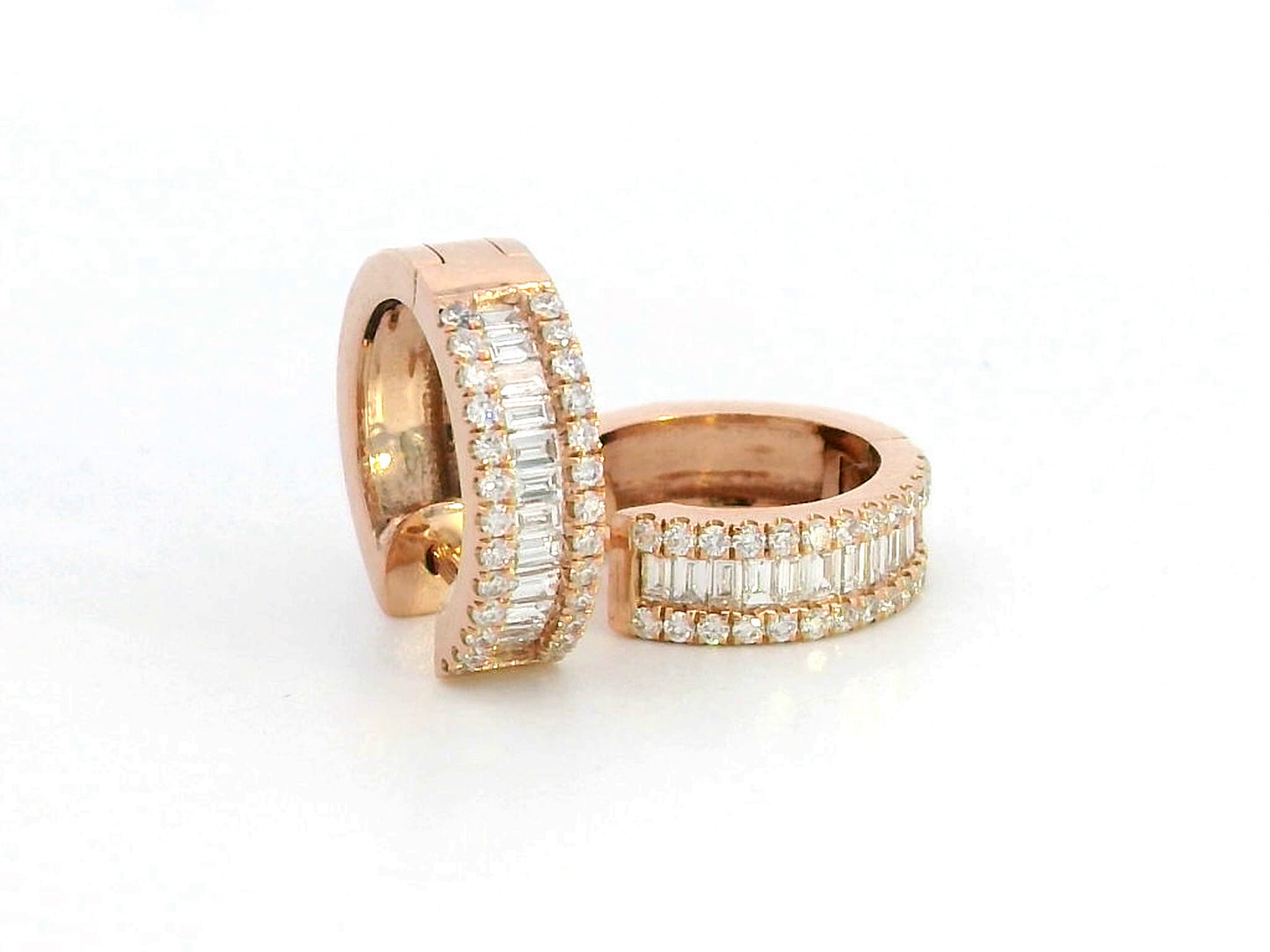 18K rose gold huggie hoop earrings with 0.58 CT round and baguette diamonds, featuring a secure and stylish design for a luxurious sparkle.