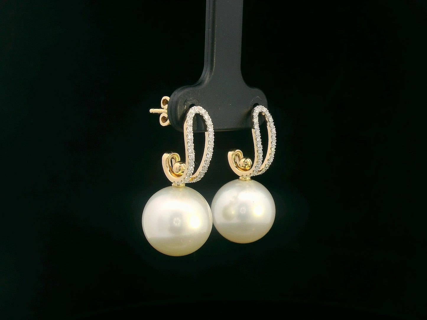 Elegant 18K gold drop earrings with South Sea white pearls (9x13mm) and 0.29ct diamond accents.