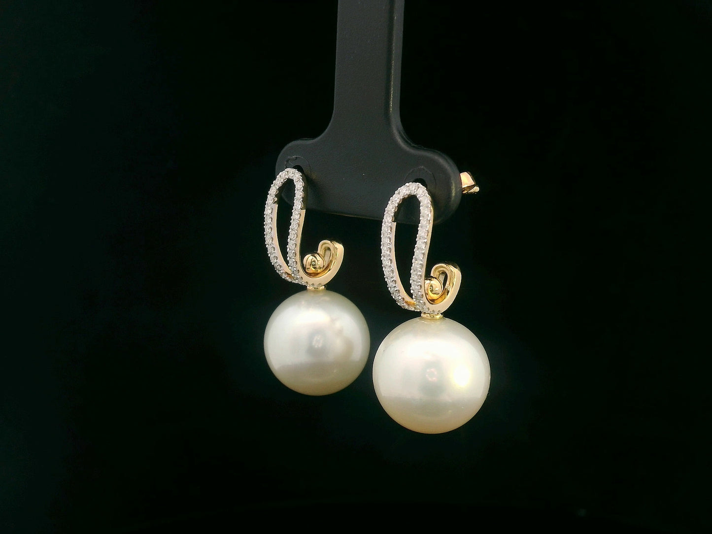 Elegant 18K gold drop earrings with South Sea white pearls (9x13mm) and 0.29ct diamond accents.