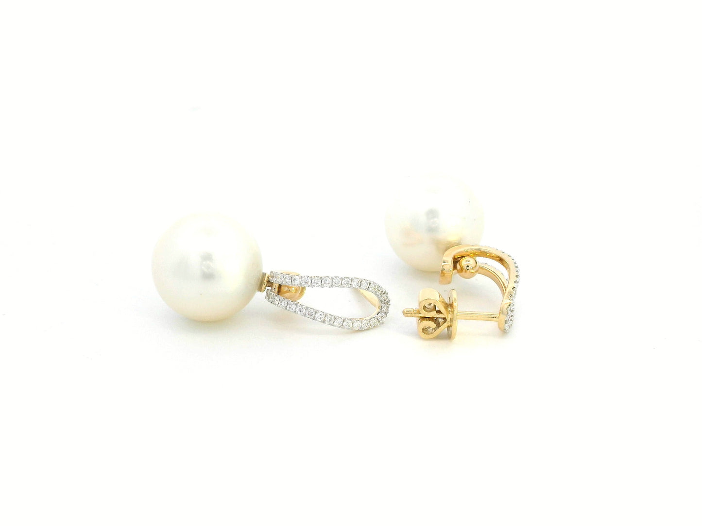 Elegant 18K gold drop earrings with South Sea white pearls (9x13mm) and 0.29ct diamond accents.