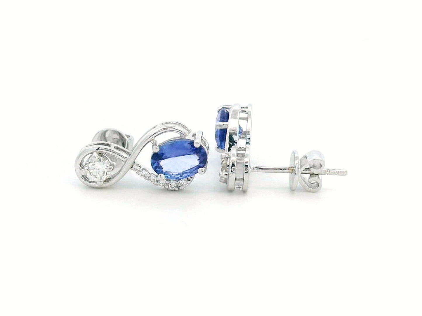 1.79 Carat Tanzanite and 0.40 Carat Diamond Earrings in 18K Gold, elegant gemstone earrings with a swirl design