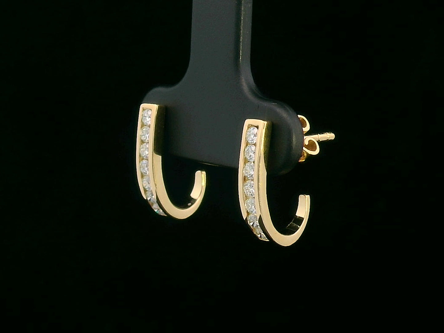 18K gold curved bar diamond earrings with 0.31ct round-cut diamonds, sleek modern design.