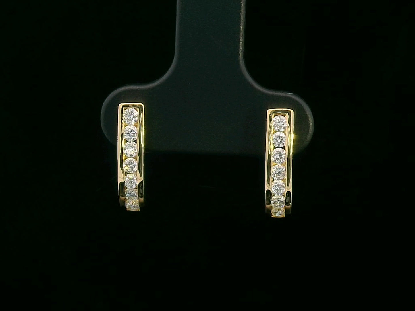 18K gold curved bar diamond earrings with 0.31ct round-cut diamonds, sleek modern design.