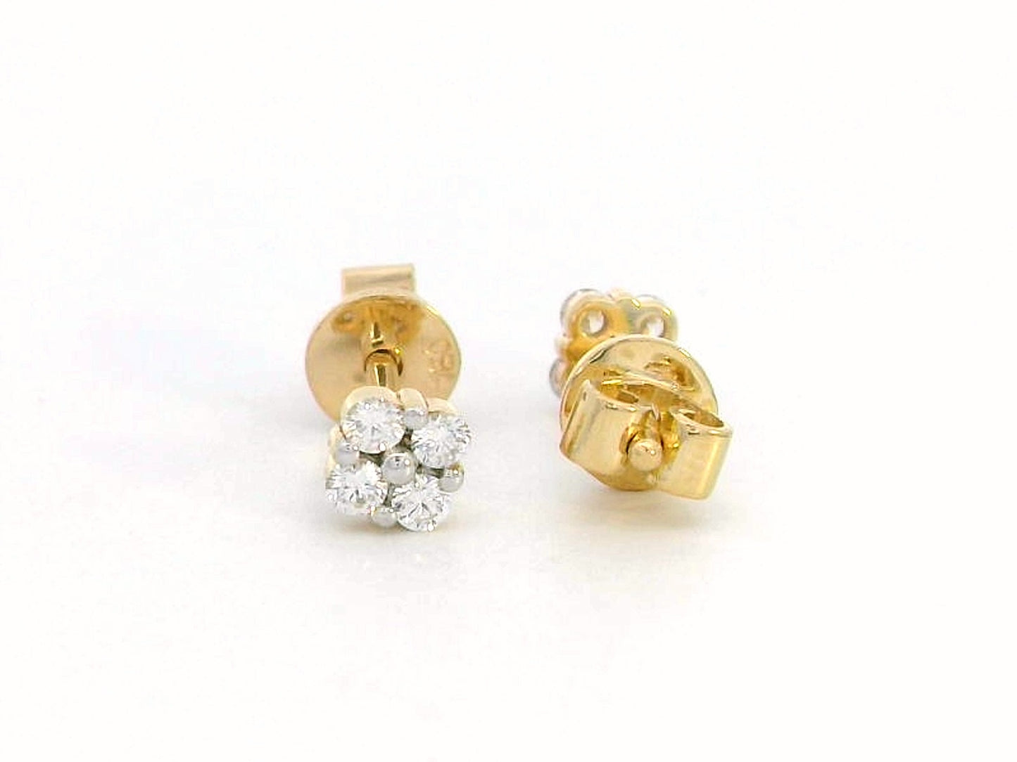 18K gold floral diamond stud earrings with round-cut diamonds, delicate flower design.
