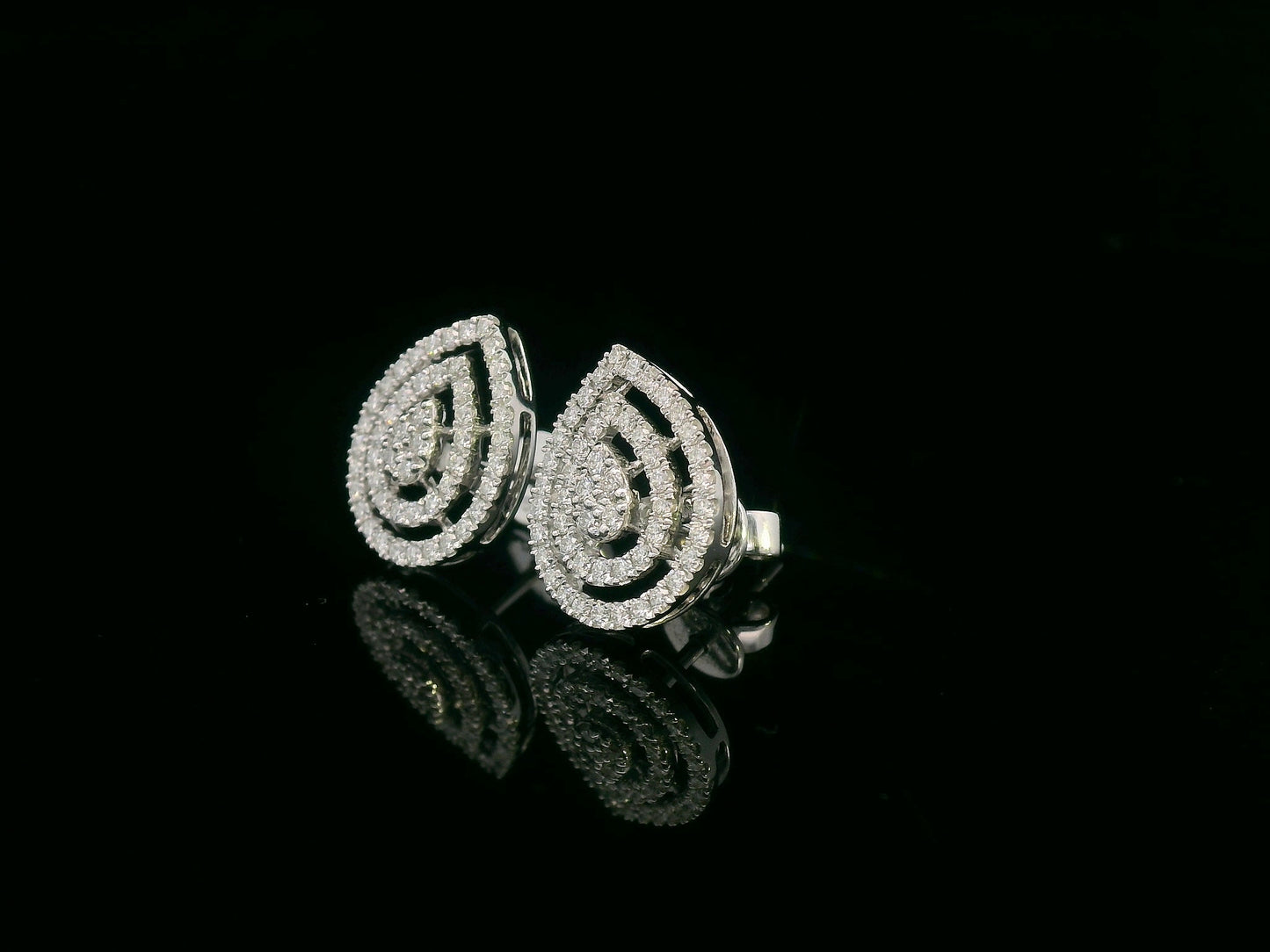 18K gold teardrop diamond halo stud earrings with double-halo design and butterfly pushbacks, set with 0.59ct natural diamonds.