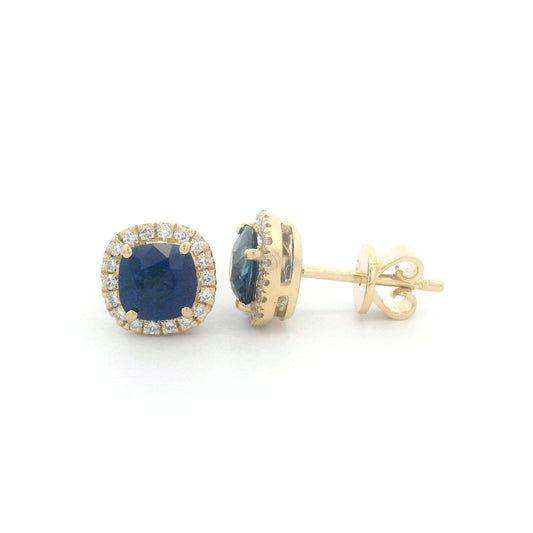 18K gold earrings with cushion-cut Blue Sapphires (1.25ct), framed by a 0.17ct diamond halo, exuding elegance and timeless luxury.
