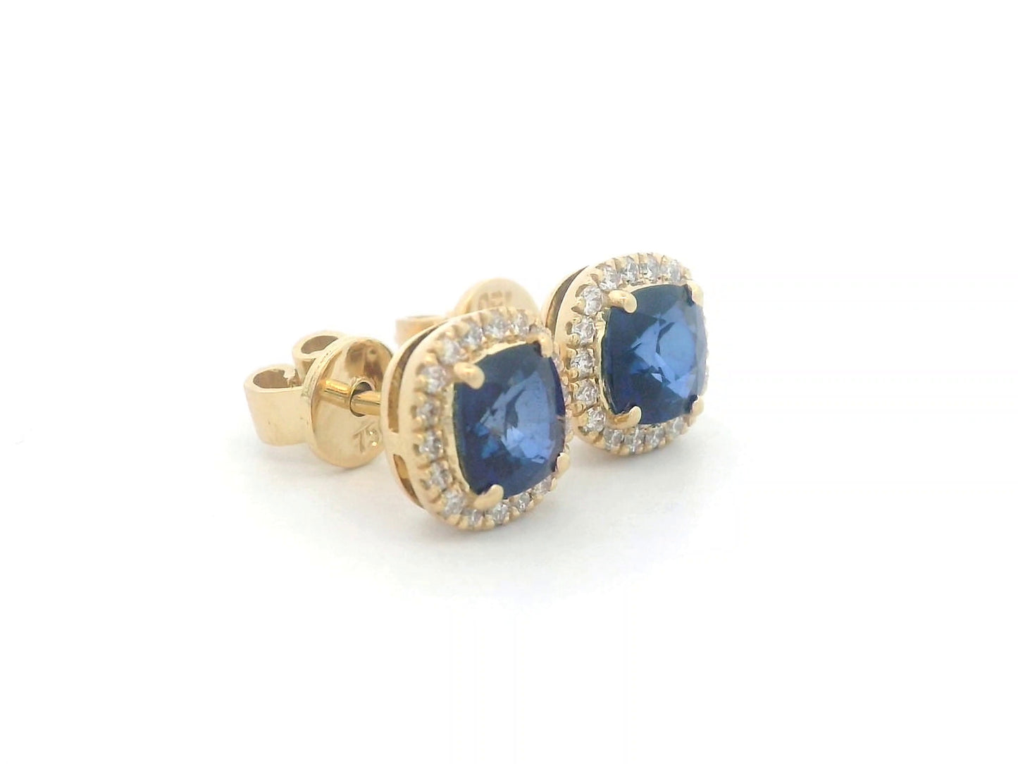 18K gold earrings with cushion-cut Blue Sapphires (1.25ct), framed by a 0.17ct diamond halo, exuding elegance and timeless luxury.