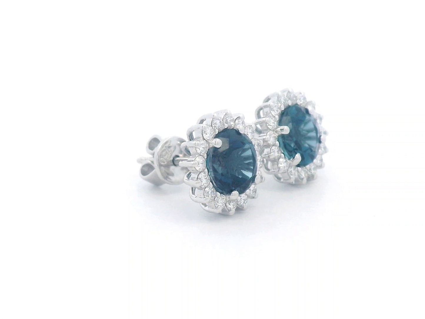 18K white gold earrings featuring London Blue Topaz with a diamond halo, totaling 1.91 carats of topaz and 0.36 carats of diamonds.