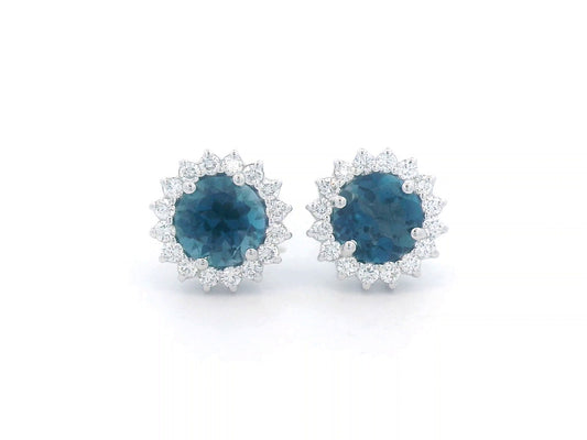 18K white gold earrings featuring London Blue Topaz with a diamond halo, totaling 1.91 carats of topaz and 0.36 carats of diamonds.