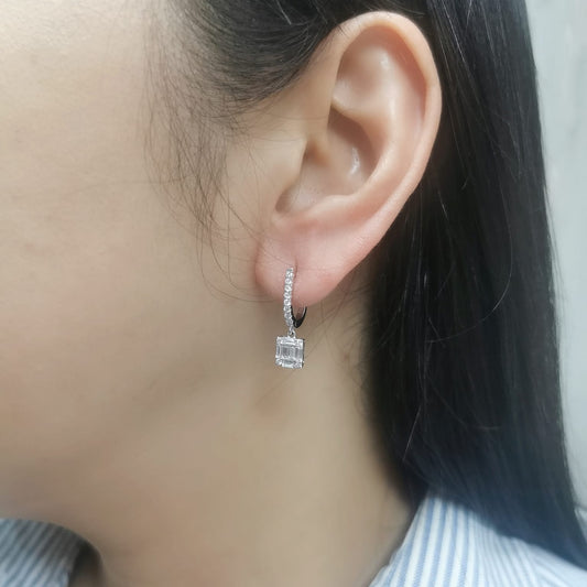 18K gold diamond drop earrings with square baguette and round diamonds.