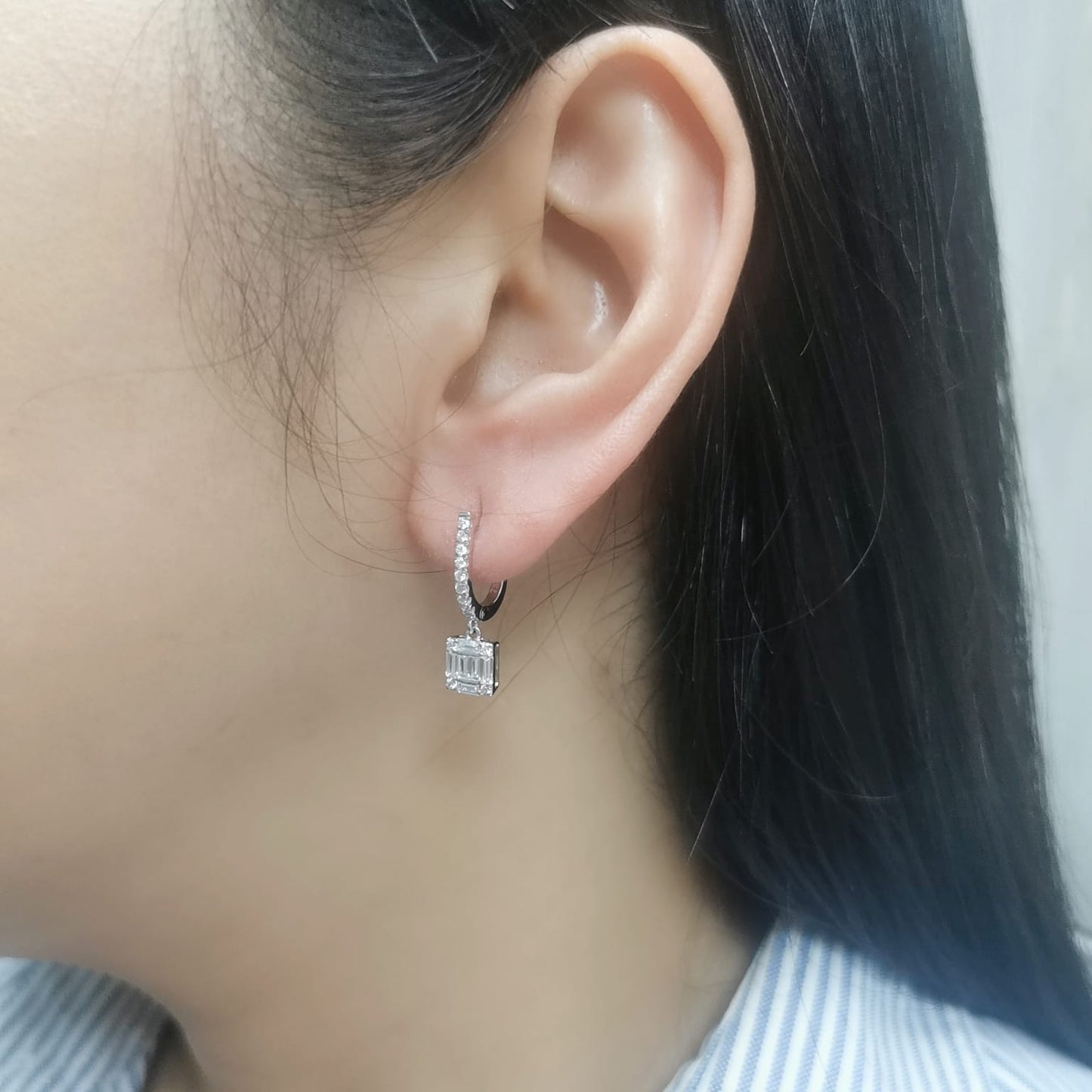 18K gold diamond drop earrings with square baguette and round diamonds.